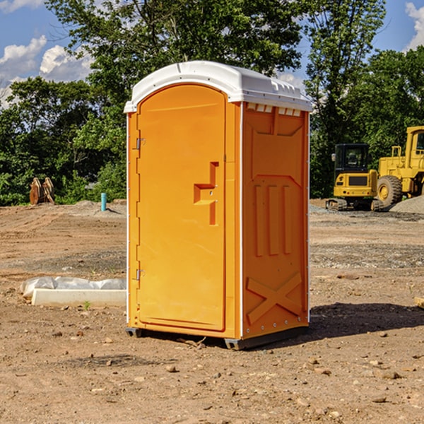 what is the cost difference between standard and deluxe portable restroom rentals in Merit